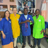 sara and lisa with daniel in gisenyi making uniforms for umutuzo